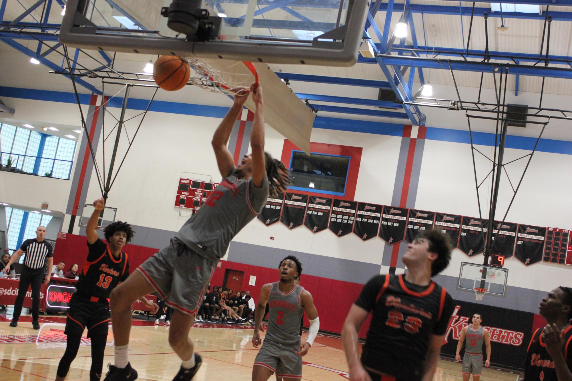 City College freshman forward Micah Brickner (12) emphatically dunks against Ventura College at Harry West Gym, Saturday, Nov. 16, 2024. Photo by Danny Straus/City Times Media