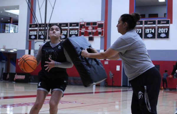 Head coach Andrea Aguilar-Montalban simulates defensive contact as Ximena Caballero drives to the basket in a practice at San Diego City College on Tuesday, Nov. 19, 2024. Photo by Tresean Osgood/City Times Media
