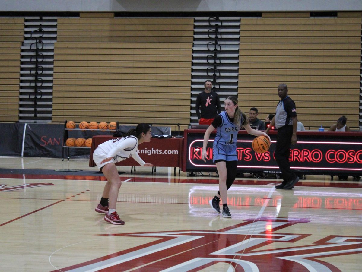 City College sophomore guard Ximena Caballero (21) picks up freshman Savannah Rowland (1) at halfcourt against Cerra Coso at Harry West Gym, Thursday, Nov. 21, 2024. 