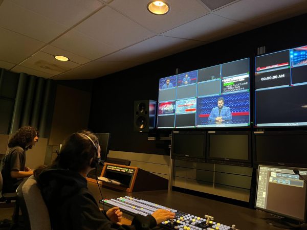 City College students Frankie Rodriguez, right, runs the teleprompter and Andrea Valdez, center, works as technical director in the control room for the Friday, Nov. 22, 2024 edition of Newscene. CTTV broadcasts from its on-campus studio in the C building. Photo by Daniela Luna/City Times Media