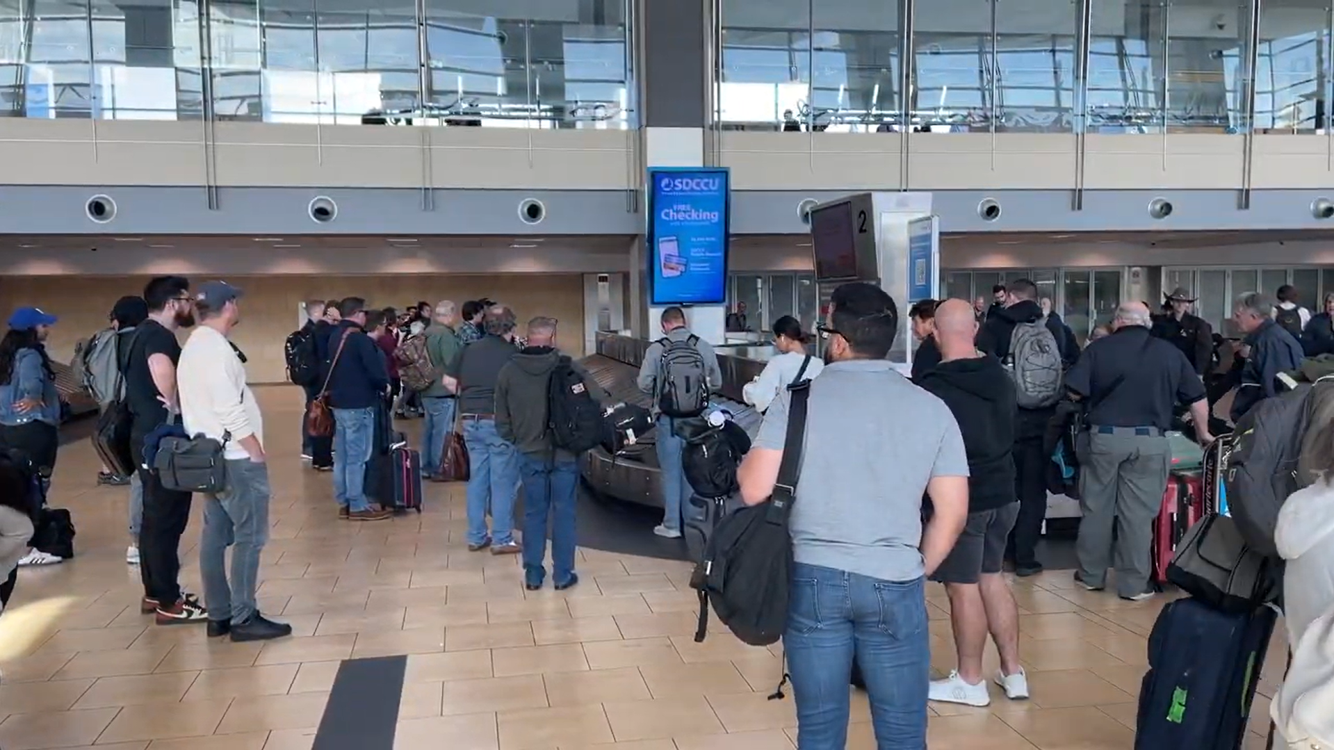 Travelers wait for their luggage in the San Diego International Airport, Thursday, Nov. 21, 2024. Photo by Nathan Fernandez/City Times Media