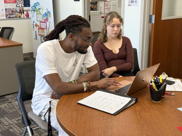 Melvin Emery III, left, a San Diego City College Transfer Center project assistant, helps Sophia Samora, right, a liberal studies student, with her transfer applications to San Diego State University and CSU San Marcos, Thursday, Nov. 13, 2024. Photo by Luke Bradbury/City Times Media