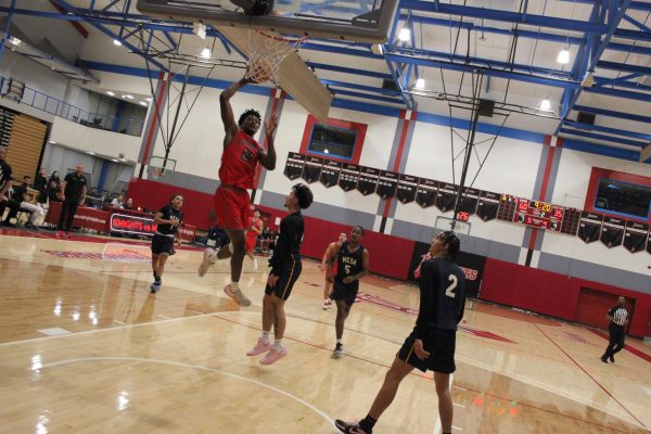 Knights sophomore forward Dillon Cubit (21) goes up for a dunk against Mesa College at Harry West Gym,  Friday, Dec. 20, 2024. Photo by Danny Straus/City Times Media