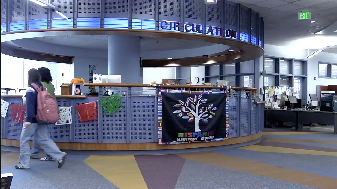 Two students walk past the circulation desk in the City College Learning Resource Center, October 22, 2024. Photo by Gina Stevens/City Times Media