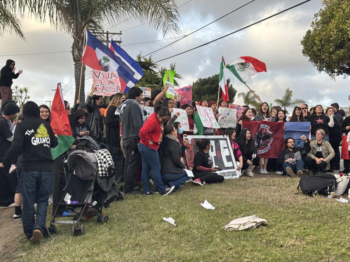 Students from Castle Park High School, San Diego City College, San Diego State University, and teachers part of the Association of Raza Educators pose for a group photo following a rally at Castle Park High School, Tuesday, February 11, 2025. The event called on school administrators to take a firm stand against the immigration policies of the Trump administration. Photo by Bailey Kohnen/City Times Media