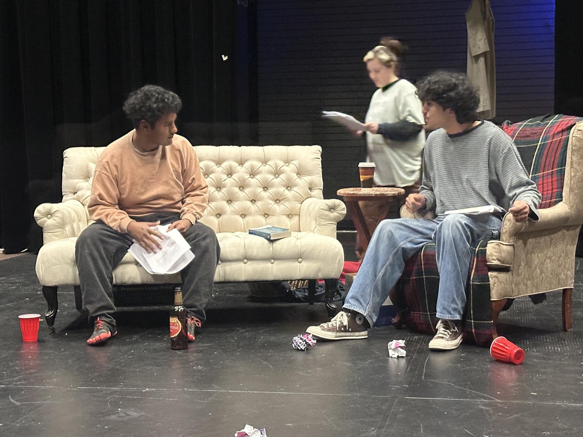 Actor’s Fortino Aguilar, left, who plays Todd, Lexie Solomon, Center, who is director, Alfredo Horta, right, who plays Tucker, Lexie Solomon directs the characters stage presence and placement in a rehearsal of ‘Tucker vs.Todd’ for the Festival of New Plays at the Black Box Theatre Thursday, March 13, 2025. Photo by Leon A. Nelson II/City Times Media