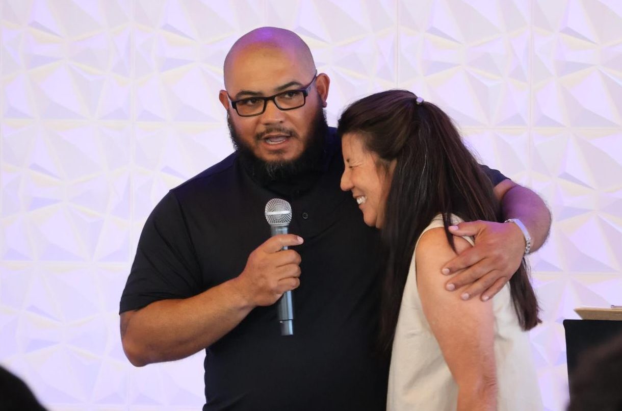 City College men’s tennis coach and women’s assistant coach Brandon Lupian, left, hugs women’s head tennis coach Jami Jones, right, while he speaks about her impact on the program at the Marina Village Conference Center, Thursday, May 15, 2025. Photo by Danny Straus/City Times Media  