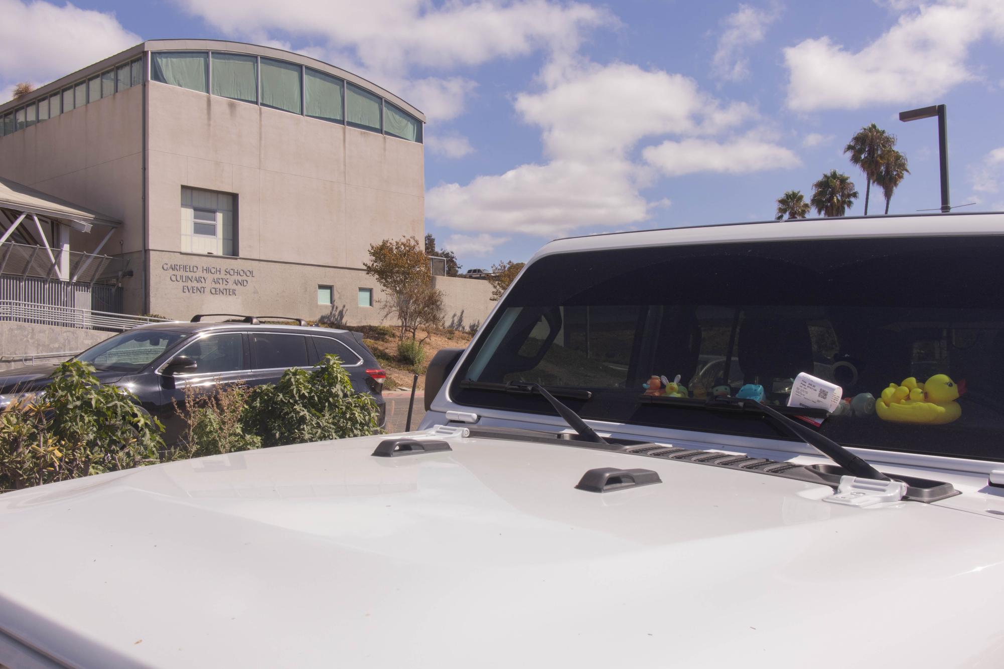 Parking ticket tucked away underneath the windshield wiper of a parked white Jeep across from Garfield High School in lot 5 at San Diego City College, Wednesday, Sept. 10, 2025. Photo by Briana Bush/City Times Media