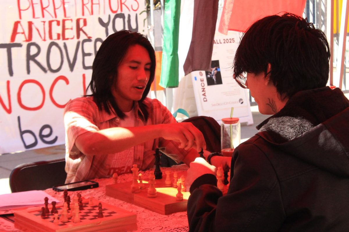 Vincent Yanez, left, plays chess with Armas Armas, right, at San Diego City College Club Rush Carnival, Tuesday, Sept. 9, 2025. Photo by Mari Pliego/City Times Media