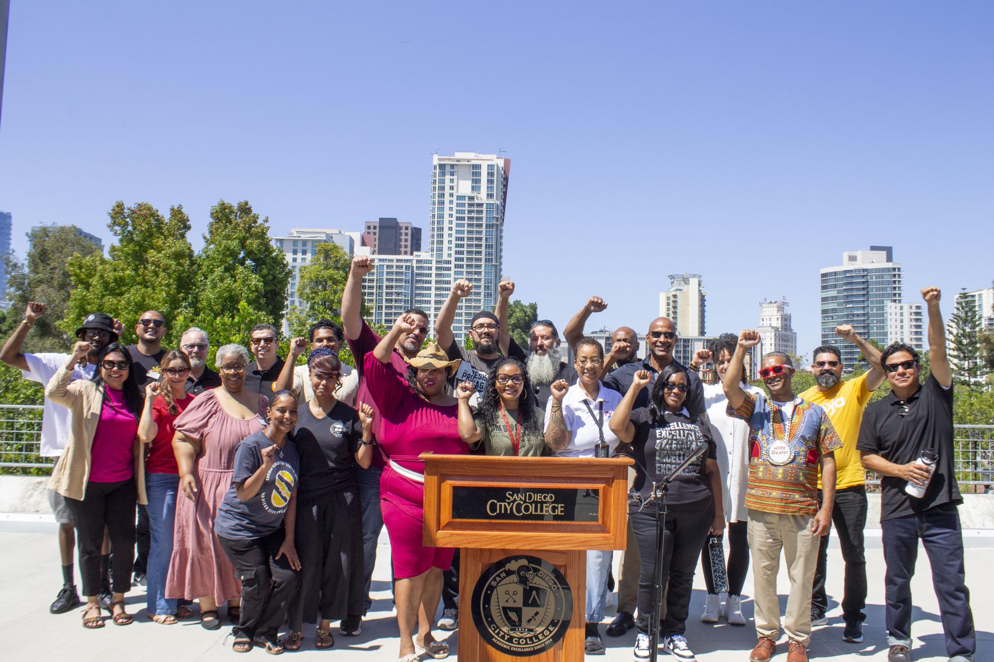 Umoja faculty put their fists in the air to empower students during the fall welcome event at San Diego City College at the A Quad, Sept. 4, 2025. Photo by Mari Pliego/City Times Media