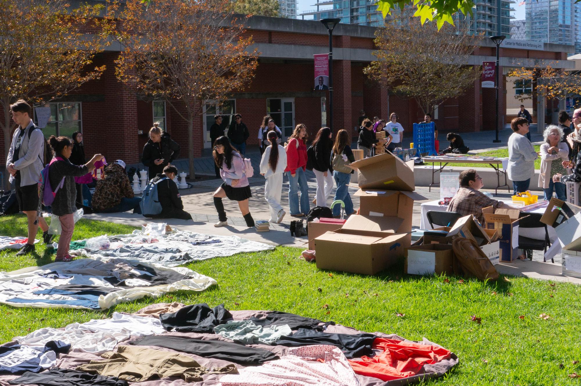 Students walk around Curran Plaza during the free gift exchange event looking at the various donations the event offers, Wednesday, Nov. 19, 2025. Photo by Briana Bush/City Times Media