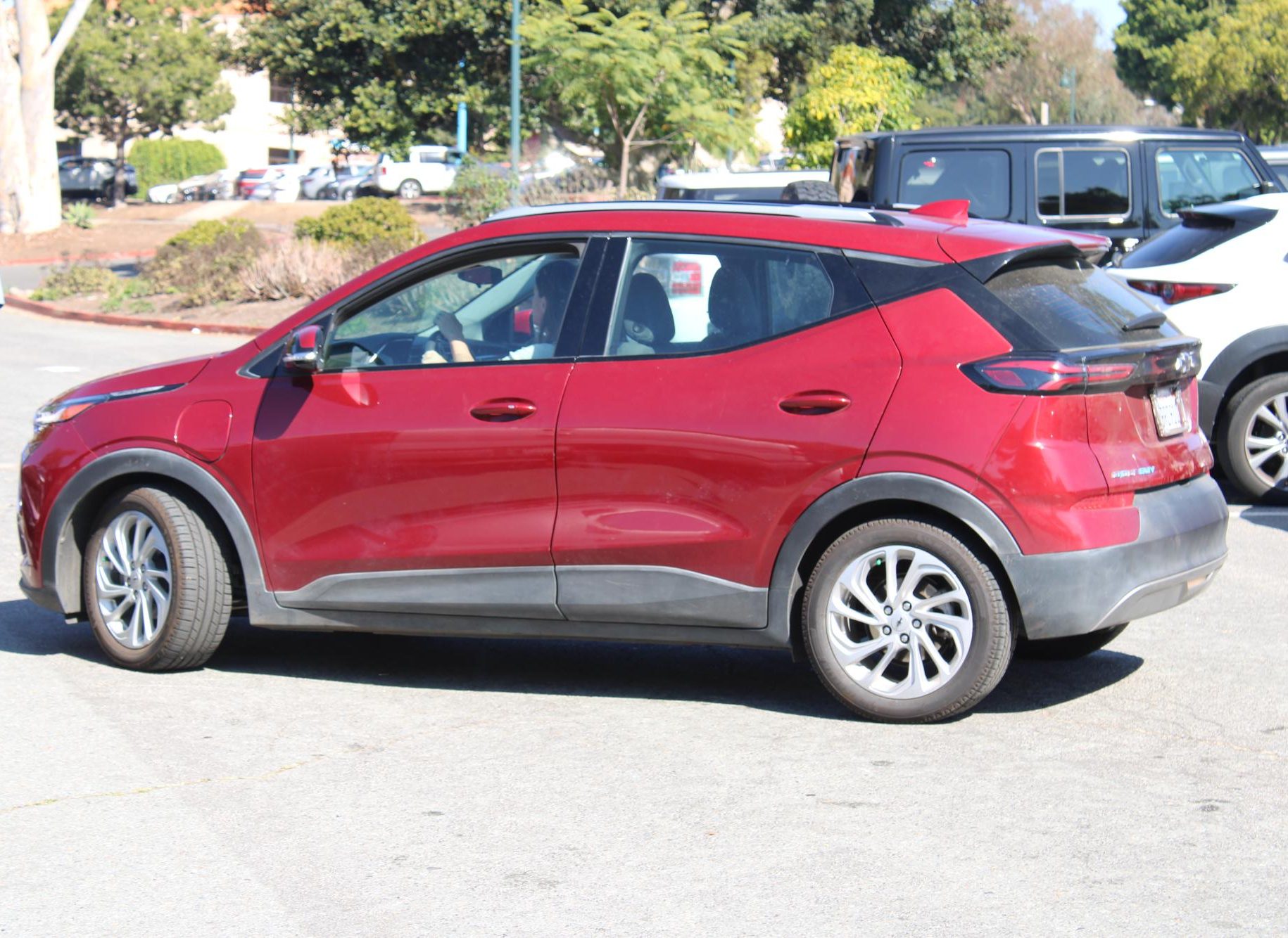 Jill Corlew, a mother and homeschool educator, backs her car into a free space in a public parking lot at Balboa Park, Tuesday, Oct. 28, 2025. Photo by Tresean Osgood/City Times Media
