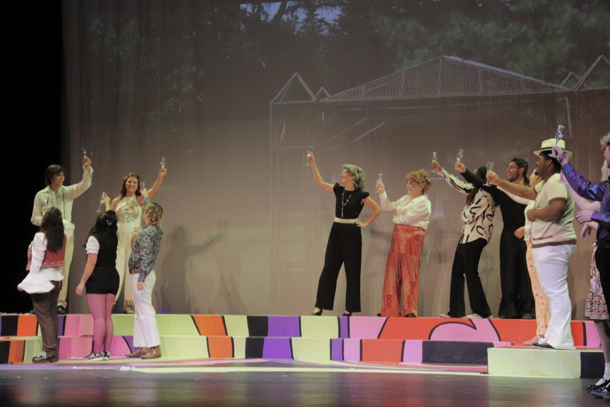 The cast of “The Taming of the Shrew” raise a glass in celebration of the newlyweds in the City College theatre programs's cross-gendered adaptation of the Shakespearean classic at a technical rehearsal. Photo by Carmen Freeman/Courtesy of the City College theatre department

