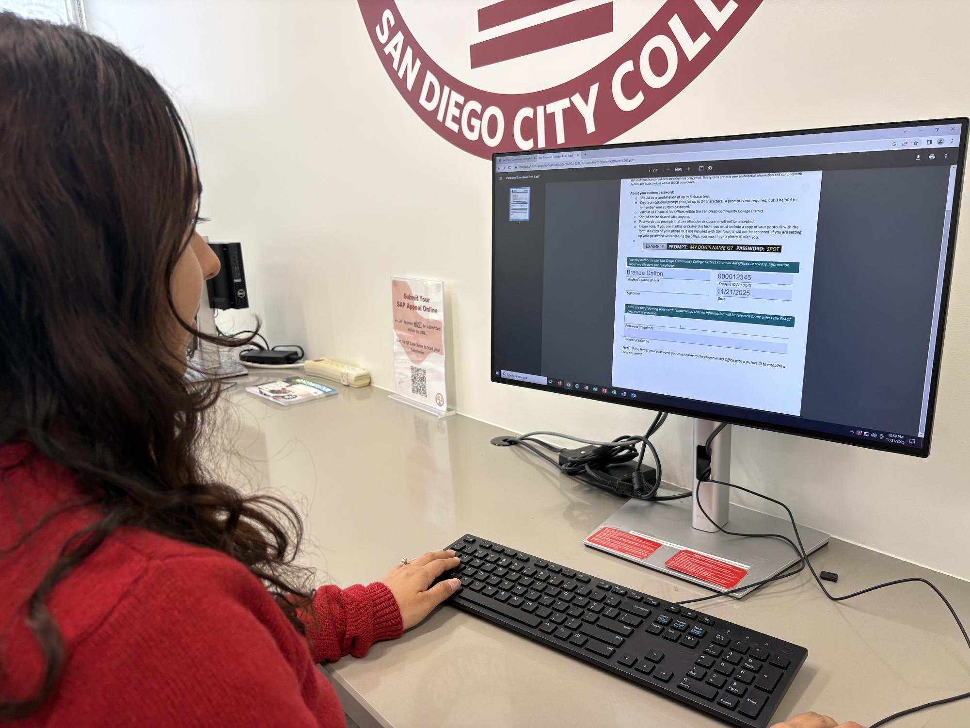 San Diego City College student Renata Gutierrez, a marketing major, fills out a Satisfactory Academic Progress appeal in the Financial Aid Office, Friday, Nov. 21, 2025. Photo by Samira Hassan/City Times Media