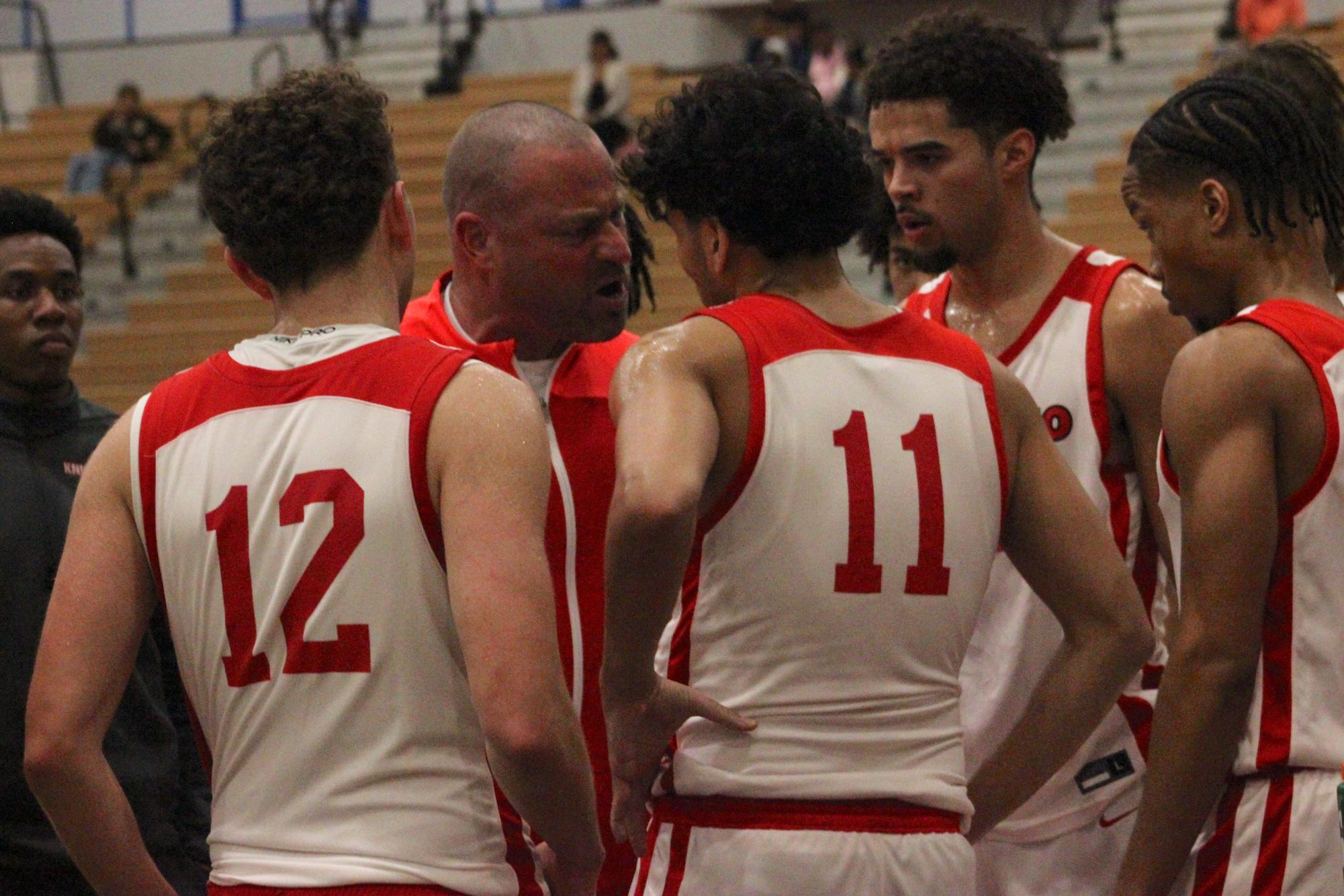 San Diego City College men’s basketball head coach Mitch Charlens, back center, tells his players to "play harder" during a timeout at Harry West Gym, Friday, Jan. 16, 2025. Photo by Nadia Lavin/City Times Media
