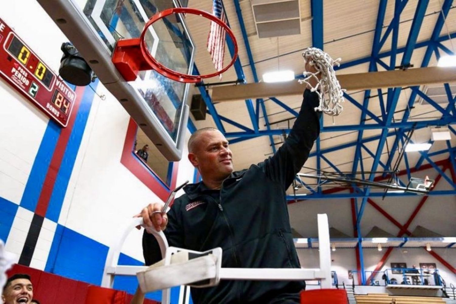 Mitch Charlens cuts down the net after the Knights defeat Ventura College to advance to the 2018 Elite Eight State championship game. Photo courtesy of Knights Athletics