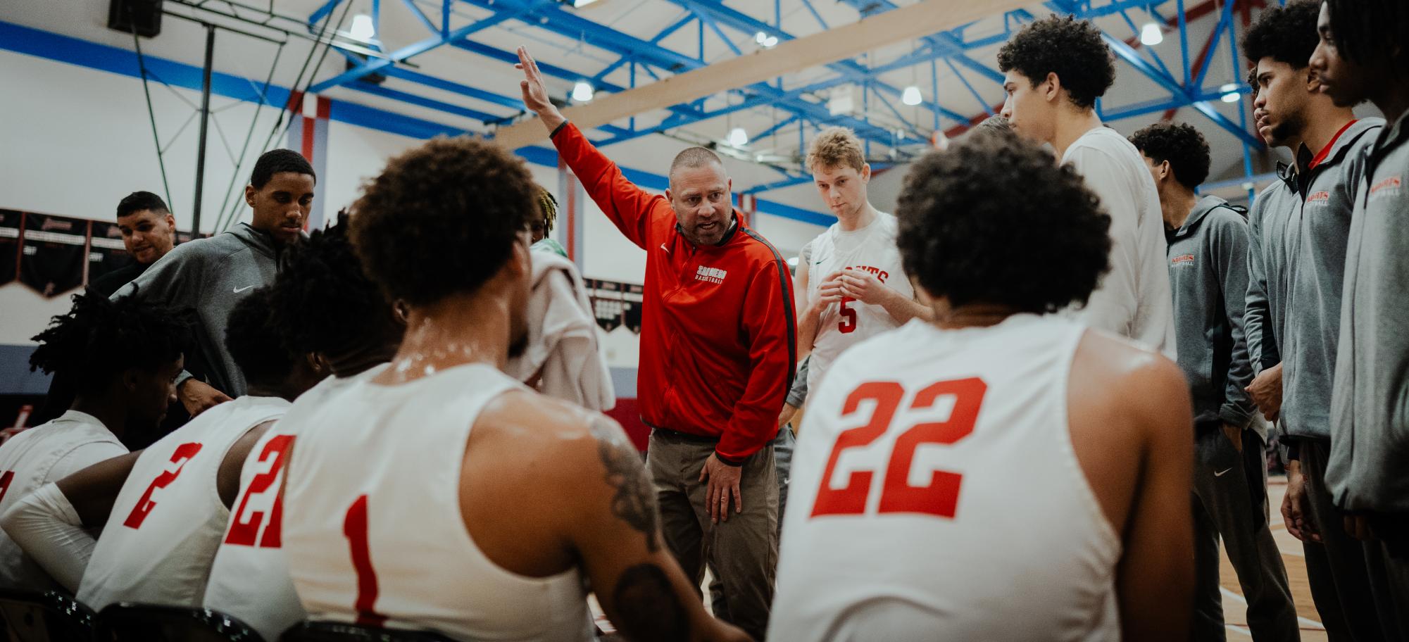 Mitch Charlens directs his team during a timeout at Harry West Gym in an undated photo. Photo courtesy of Dexter Stratton (5)