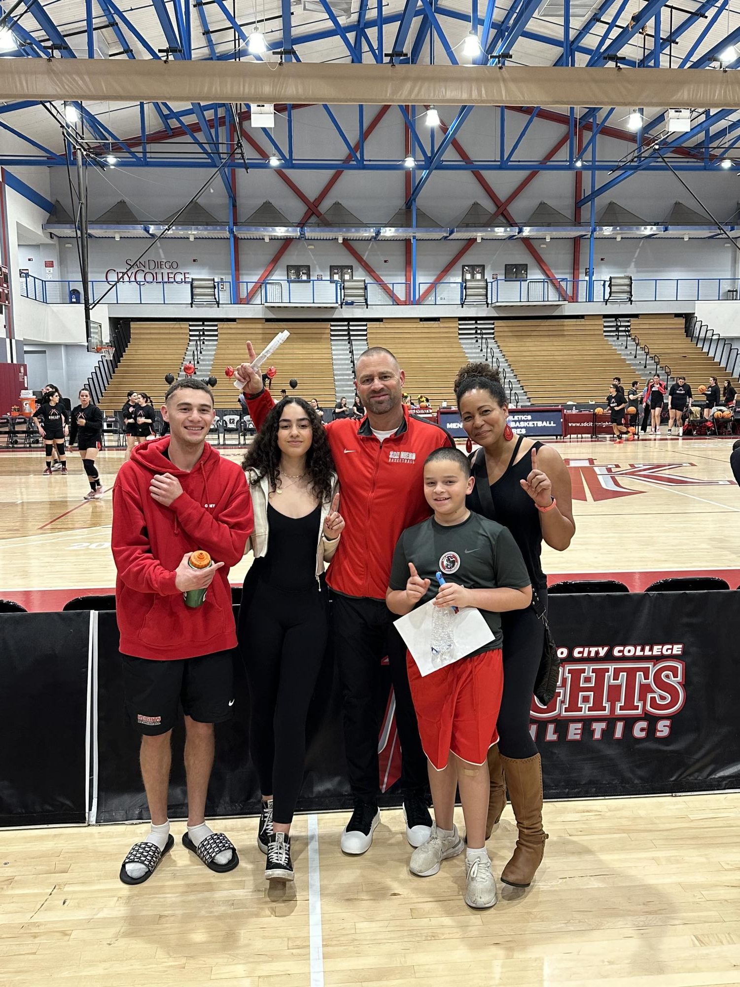 Mitch Charlens Erin Charlens pose with their children Brandon, Chloe and and Jay, at Harry West Gym in an undated photo. Photo courtesy of Erin Charlens
