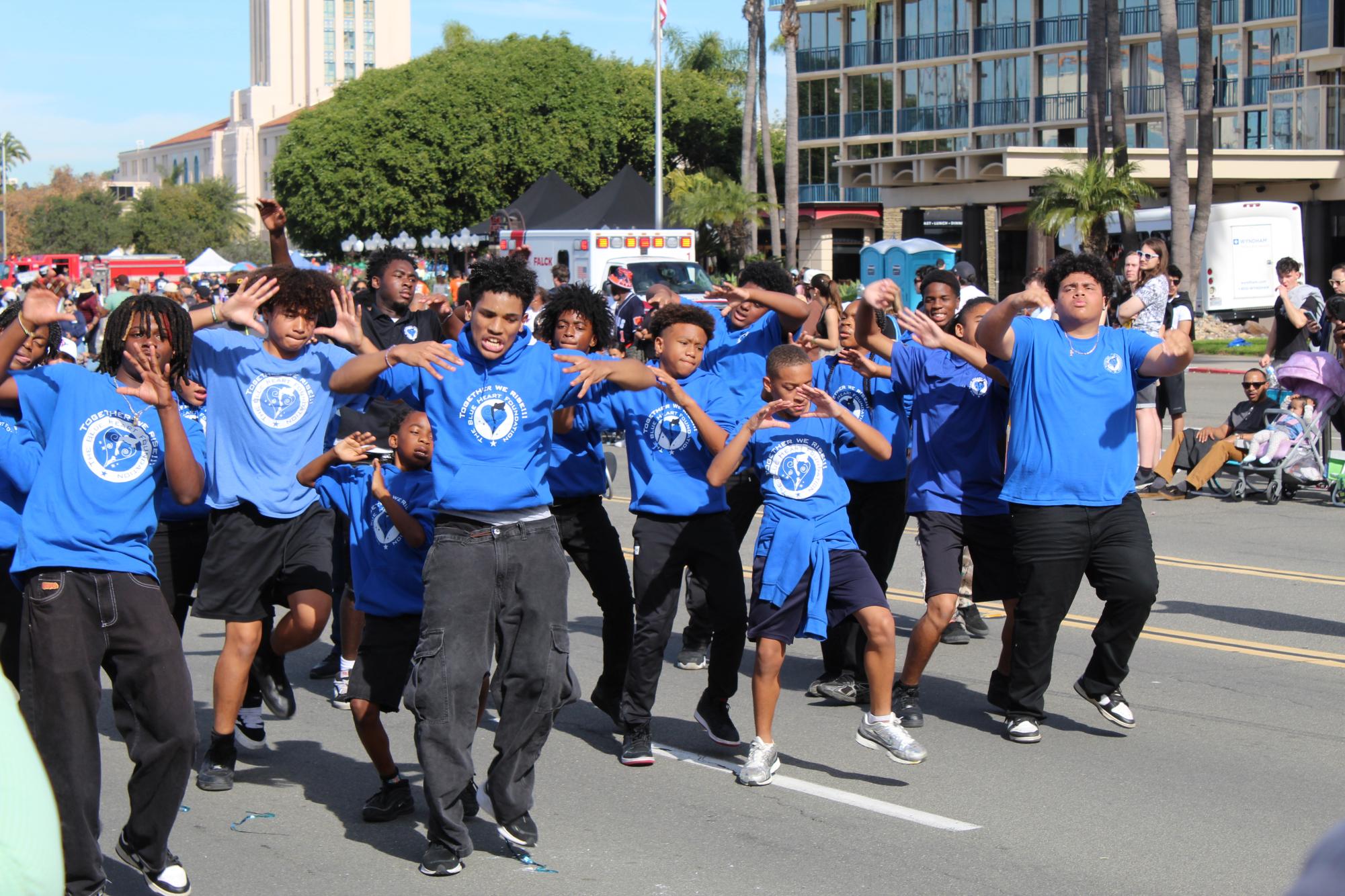 Dancers from The Blue Heart Foundation stomp, clap and move in unison along the route of the Martin Luther King Jr. Day parade in San Diego, Sunday, Jan. 18, 2026. The San Diego youth organization supports African American young men ages 13-18 and provides adult mentorship and educational growth, according to its website. Photo by David J. Bohnet/City Times Media