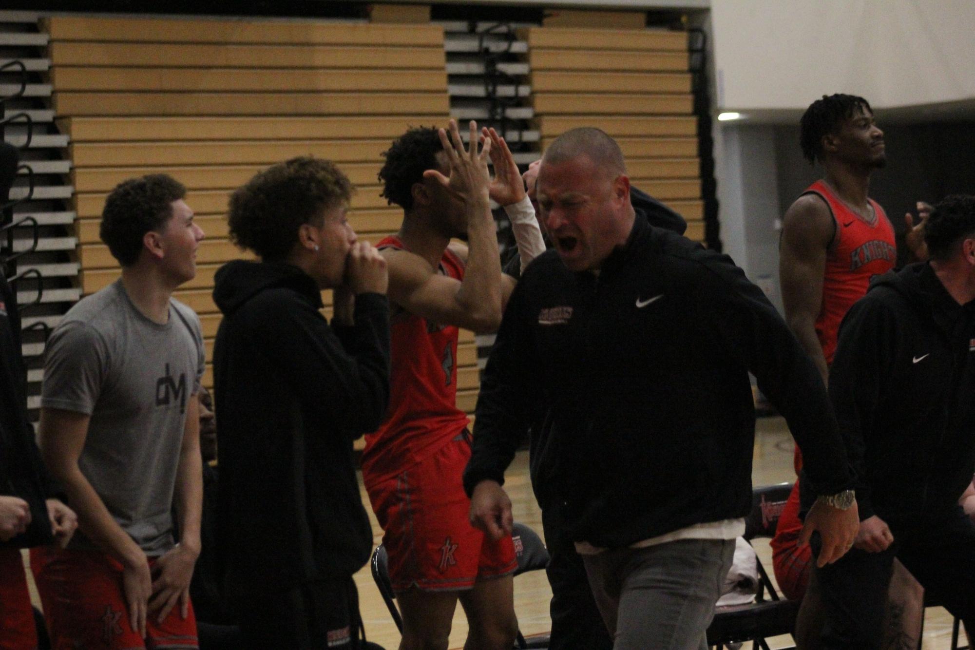 City College head coach Mitch Charlens, right center, and the Knights’ bench react after a referee’s call against the Knights at Harry West Gym, Saturday, March 1, 2025. Photo by Nadia Lavin/City Times Media
