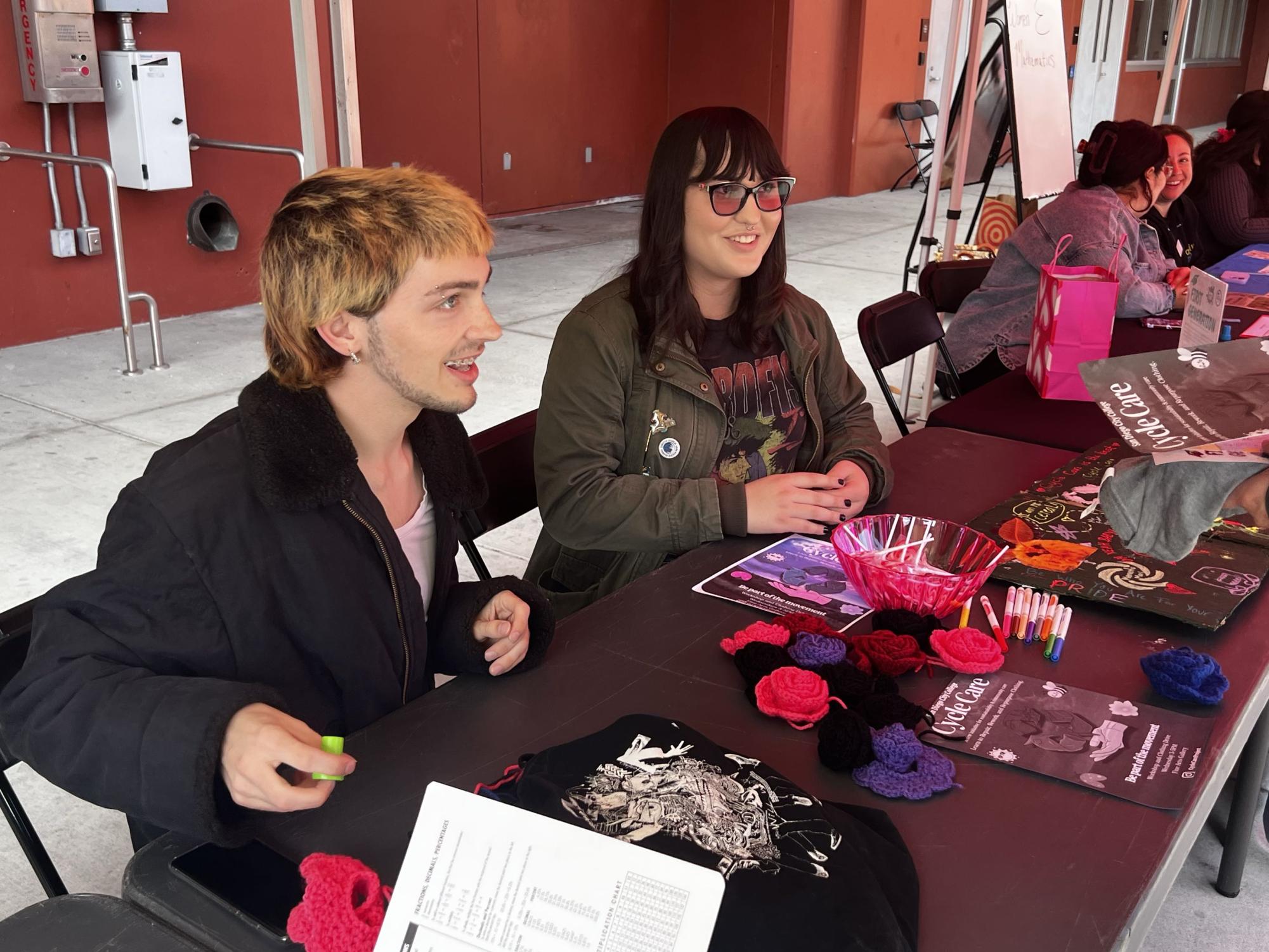 Students Devin Glenn, left, and Athena Paredes, right, speak to a student during the City College Valentine's Day Club Rush event, Thursday, Feb. 12, 2026. Photo by Rosemary Archer/City Times Media