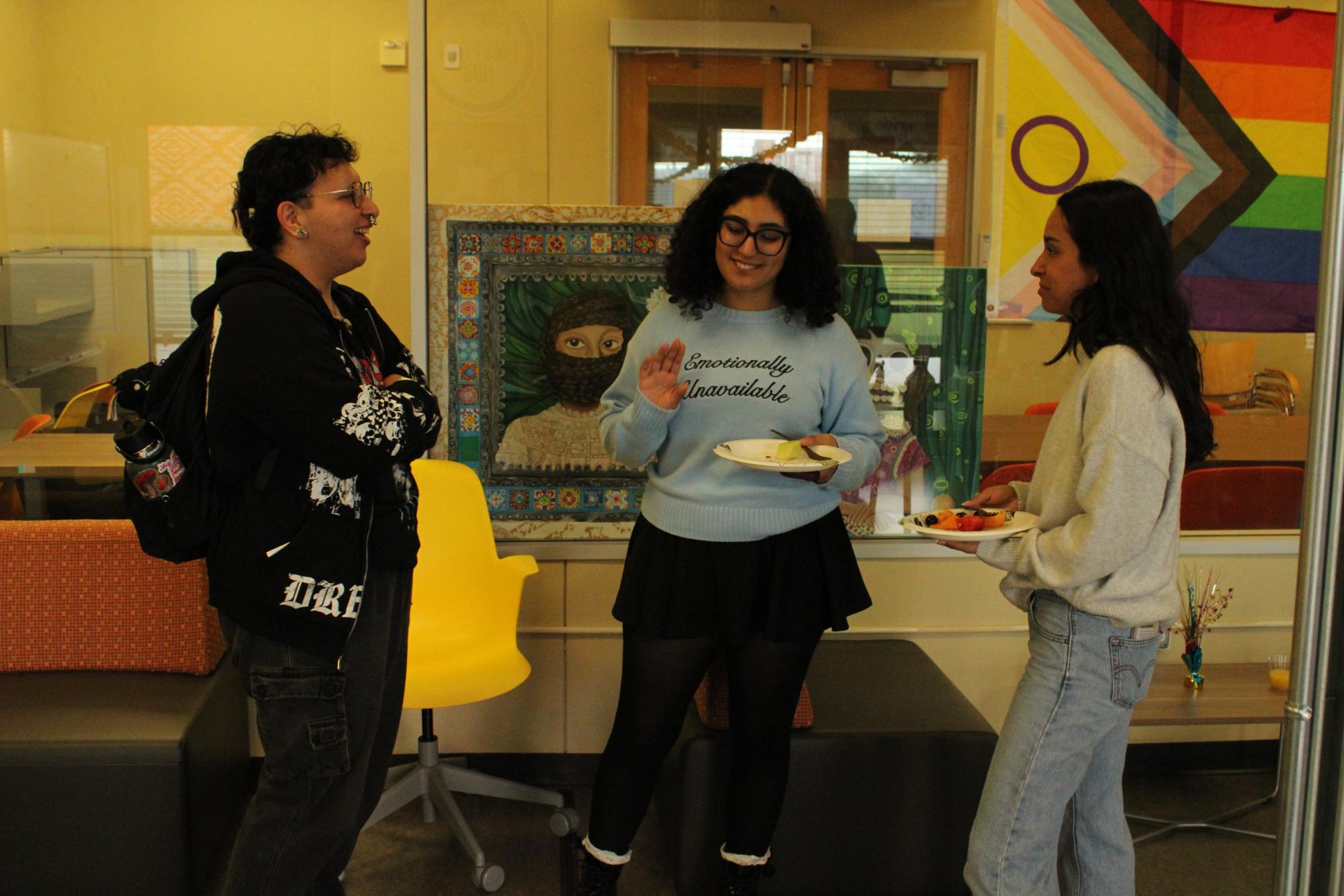 San Diego City College students Eliot Mars, left, Anya Villanueva, center, and Daniah Weny, right, converse over food in the Intercultural Center in L-206, Wednesday, Feb. 11, 2025. Photo by Tresean Osgood/City Times Media