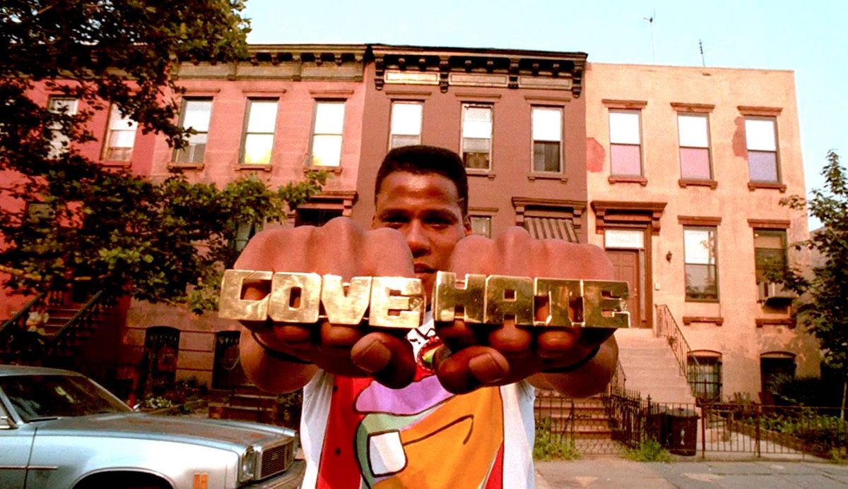 Bill Nunn plays Radio Raheem, a young black man who always carries around a boombox playing Public Enemy’s “Fight the Power,” in Spike Lee’s 1989 film “Do the Right Thing.” Photo via IMDb