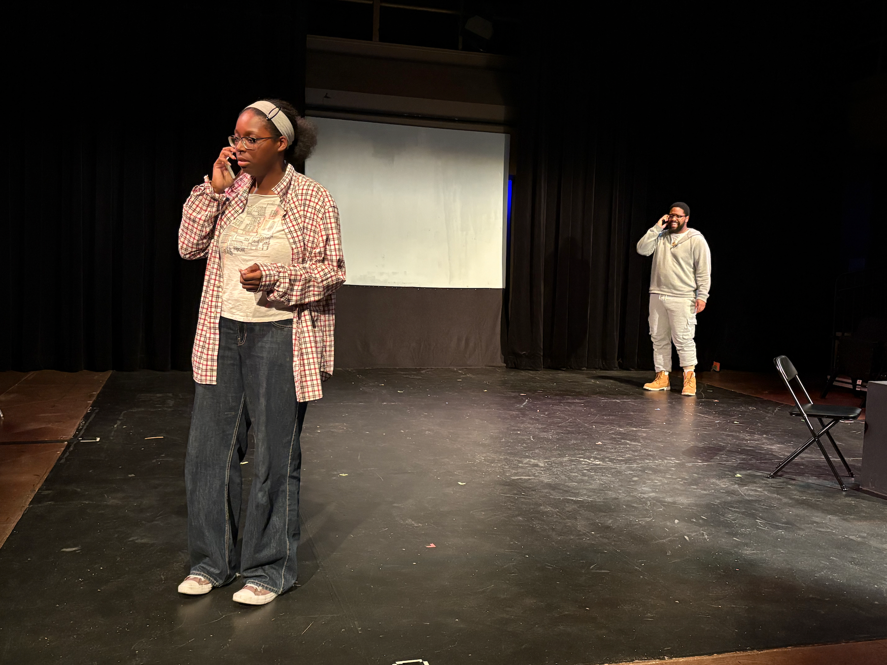 T, played by Janessa Brown, left, is on a call with Rick, played by Diavian Irby, right, in the 11th Annual Festival of New Plays at the Black Box Theater, Thursday, March 19, 2026. Photo by Crow Ruiz/City Times Media