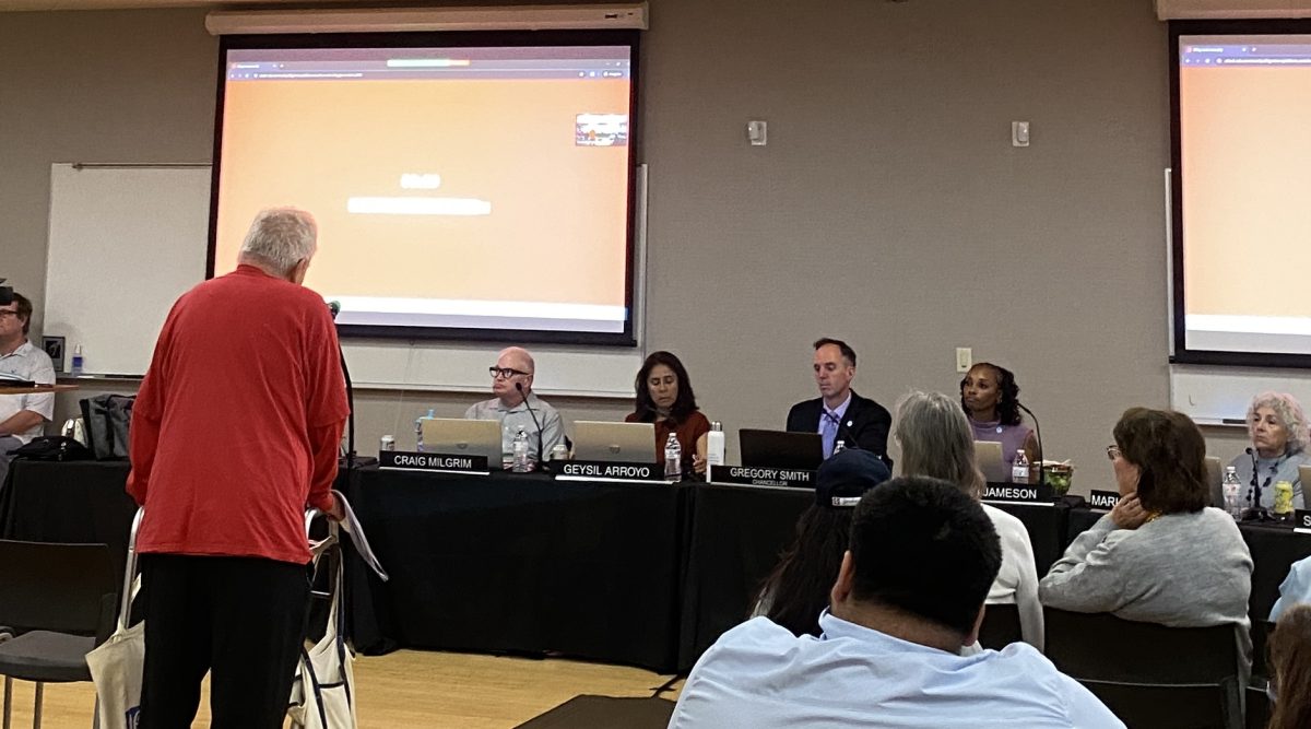 Members of the SDCCD Board of Trustees listen to David Otto, in red, a member of the Farmworkers Movement, addressing the issue of changing the College of Continuing Education’s César E. Chávez Campus name at a special meeting, April 6, 2026. Photo by Marisol Sandoval/City Times Media