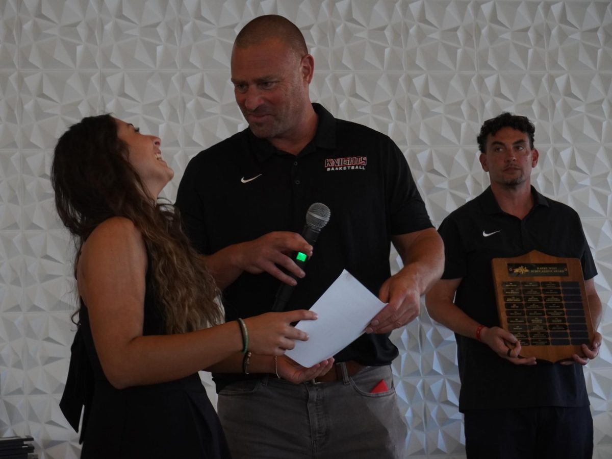 Angie Palmerin accepts the Harry West Scholarship Award from basketball head coach Mitch Charlens at the Athletics Banquet, Thursday, May 14, 2026. City Times Media/ Photo by Itzel Martinez 