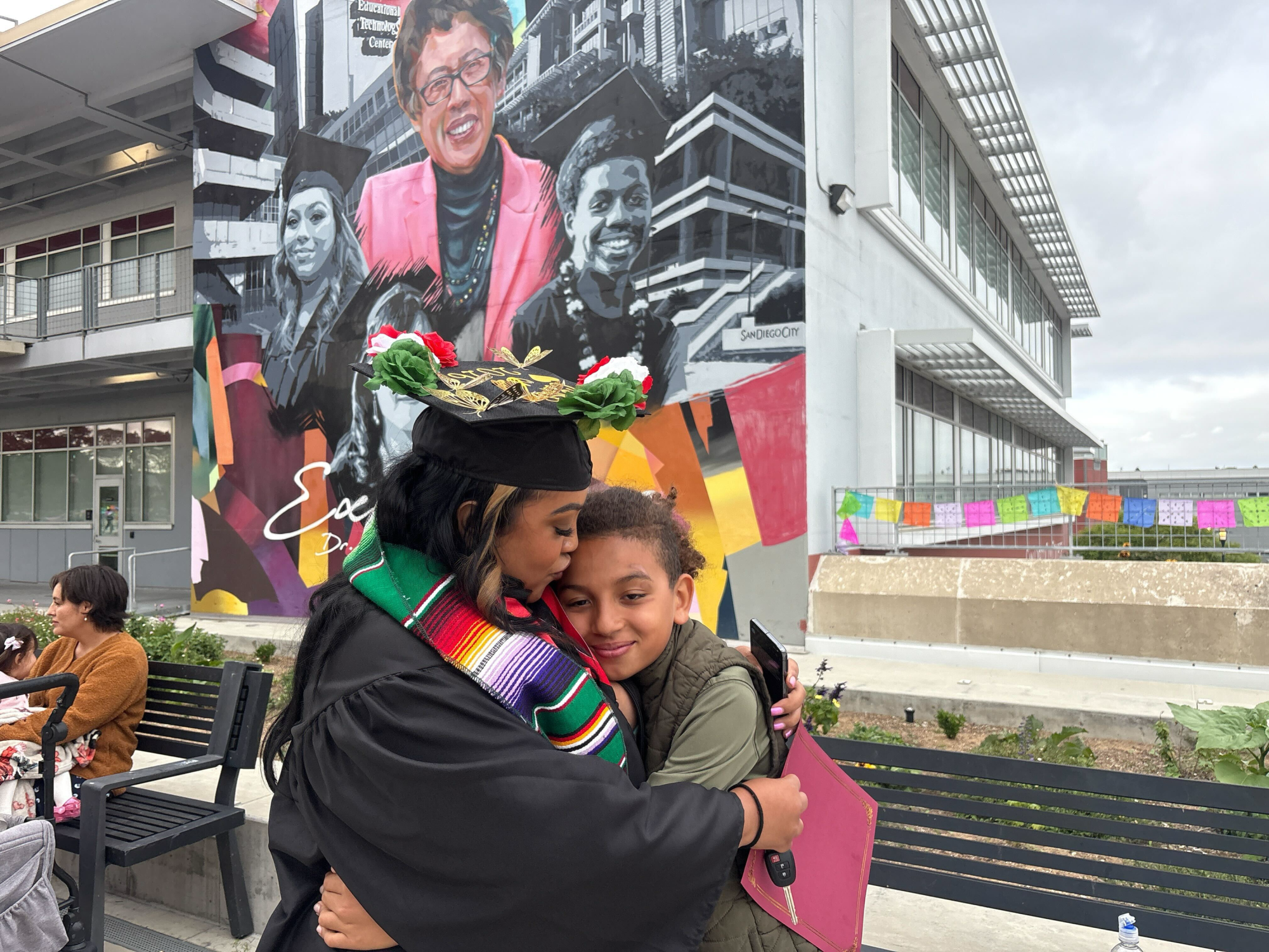 City College student Racquel le Blanc embraces her son after the 55th Annuals Chicano Latina graduation celebration, Friday, May 15, 2026. Photo by Samira Hassan/City Times Media